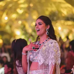 A candid shot of Manisha enjoying her sangeet. This look was designed to be as fun as it is fashionable, allowing her to celebrate in style.