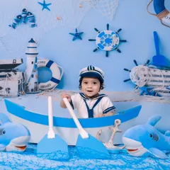 Ahoy, matey! Our sailor theme features a boat, sharks, and a complete nautical backdrop for a fun sea adventure.
