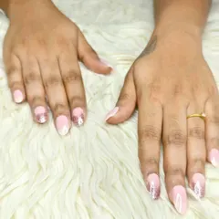 A delicate ombre effect with a natural pink base fading into sparkling rose gold glitter at the tips.