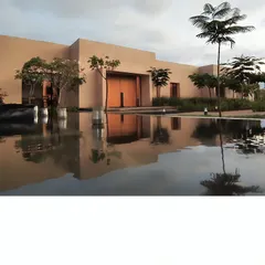 This is Earthsong, an experience center we designed to feel like it grew right out of the land. The minimalist, earth-toned structure is reflected in the water, creating a moment of pause and connection with the environment before you even step inside.