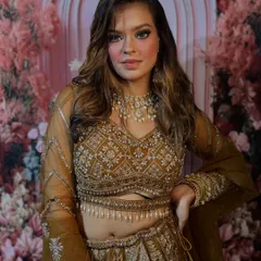 Another angle of this gorgeous party look. The embroidered lehenga is complemented by a bronzed, glowing makeup base and a classic smokey eye, a versatile technique you'll master in my classes.