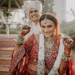 Pure happiness and energy. This bride is ready for her Pheras, rocking a classic red lehenga with a makeup look that's fresh, radiant, and full of life.