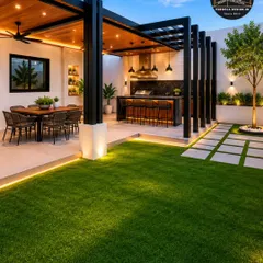 An evening of luxury awaits. This expansive backyard pergola covers a multi-zone outdoor living area, complete with a dining space and a full bar. The warm, integrated lighting and wood-panelled ceiling create an inviting atmosphere for hosting and entertainment.