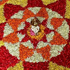 Art and culture come together in this beautiful Onam pookalam. Children learn about the harvest festival of Kerala by arranging flower petals, creating a stunning piece of collaborative art.