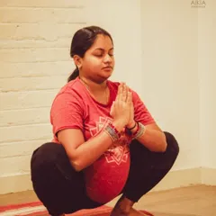 We support mothers through every stage of their journey. This moment from our prenatal yoga class captures the serenity and strength of an expecting mother in Malasana (Garland Pose). Our sessions are designed to nurture both mother and baby, preparing the body and mind for childbirth.
