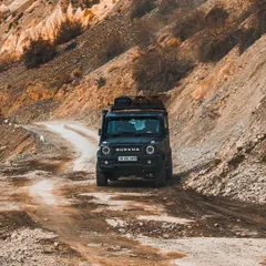A Force Gurkha navigating the rugged terrain of Spiti Valley. This shot combines automotive and adventure travel, perfect for brands targeting off-road enthusiasts and explorers.