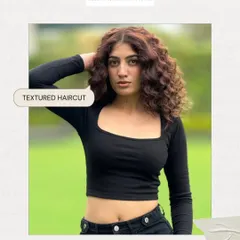 This textured haircut is a whole mood. It’s designed to make your natural curls the star of the show, adding volume and effortless shape.