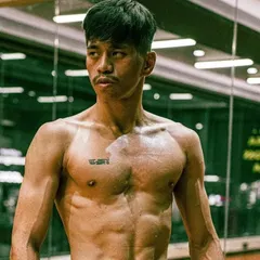 A portrait of instructor Avilash. His dedication to the striking arts is evident in his physique and focus. He leads our weekend striking classes, coaching students on everything from basic punches to advanced fight strategy.