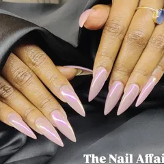 Another angle of the stunning iridescent stiletto nails, showing the beautiful light-shifting properties of the chrome powder.
