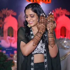 This bride is glowing as she displays her beautiful henna during her mehandi event.