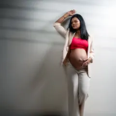 A portrait that speaks of power, grace, and resilience. This mom-to-be's strong pose and confident gaze tell a story of strength and individuality.