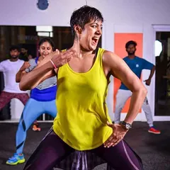 This is me in my element, leading a high-energy Zumba fitness session. My focus is on making every move fun and accessible, so you can feel the music and forget you're even working out. This is what pure joy and passion for dance looks like.