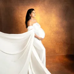 The color version of the fine-art drape shot, showing how a simple change to a textured, warm backdrop can alter the mood of the portrait.