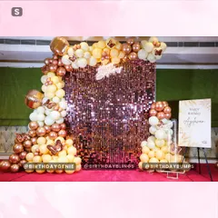 For a touch of elegance, we designed this beautiful butterfly-themed celebration. The centerpiece is a sparkling rose gold shimmer wall, framed by an organic balloon garland in soft peach, white, and metallic tones, accented with delicate butterfly details.