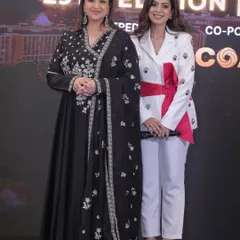 On stage with actress Parineeti Chopra for a COA event. Sharing the stage with celebrities requires a professional yet warm presence, ensuring they feel welcome and the event flows smoothly.