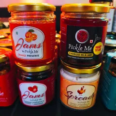 A stack of our sweet and savoury bestsellers. Featuring Orange Preserve, Strawberry Jam, Chorizo in a Jar, and our creamy Chicken Spread.