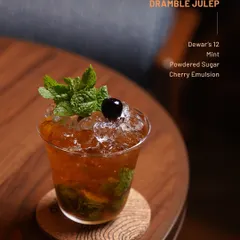 A refreshing Dramble Julep from our Dewar's 12 series. This easy-sipping cocktail blends mint, cherry, and powdered sugar for a bright and balanced drink.