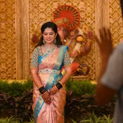 A full-length view of her reception look, set against a beautifully decorated backdrop.