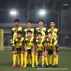 The team that trains together, wins together. A group photo of one of our youth teams after a tough training session under the lights.