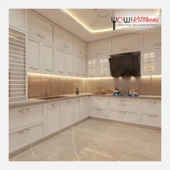 Another perspective of the timeless white kitchen, showcasing the ample storage and the warm glow of the under-cabinet lighting on the textured backsplash.