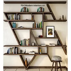This modern, asymmetrical bookshelf is a piece of art in itself. The dark wood and interesting angles create a dynamic display for books and decorative objects.