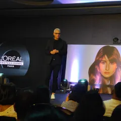 Watching a master stylist from L'Oreal demonstrate advanced techniques on stage. These sessions provide a lot of inspiration and new ideas for my clients.
