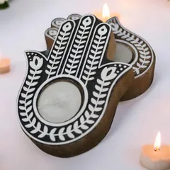 These wooden Hamsa Hand T-light holders are intricately painted and perfect for adding a traditional yet modern touch to your pooja room or home decor. They make for a unique and spiritual gift.
