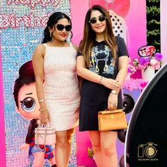 Stylish guests at a doll-themed birthday bash. Our photo booth adds a touch of glamour and fun to children's parties and family celebrations.