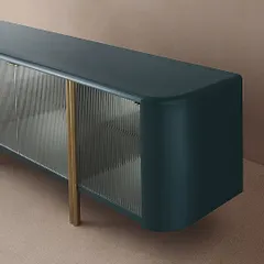 A modern and sophisticated sideboard, showcasing our mix of materials. This piece features a metal structure, tempered fluted glass doors, and a high-quality PU finish in a deep, trendy color.