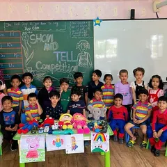 A full class of our preschoolers ready for their Show and Tell competition, surrounded by their favorite toys and characters. The classroom is buzzing with excitement and stories.