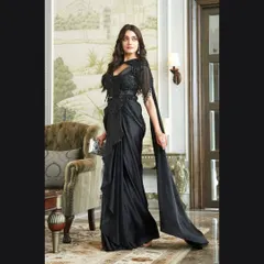 This shot shows the beautiful flow and drape of the black saree gown, making it look both elegant and easy to move in. A perfect rental for a cocktail party.