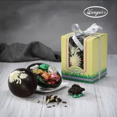 The best kind of surprise. This large chocolate Easter egg cracks open to reveal a hidden treasure of smaller, foil-wrapped handmade chocolates inside.