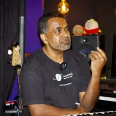 I love these moments of direct interaction during our workshops. Here, I am explaining a music theory concept in our studio. We keep our groups small so I can provide personalized feedback and answer every question.