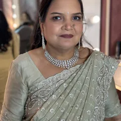 A beautiful and elegant makeover for a family member, with soft makeup and a classic saree.