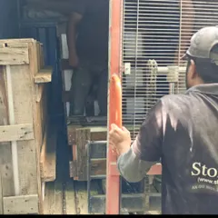 A look inside the truck as our team loads a crated sculpture. We ensure every piece is secure for its journey.
