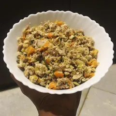 A finished bowl of my chicken and veggie meal. You can see the real chunks of meat and vegetables. No brown pellets, just honest, gently cooked food.