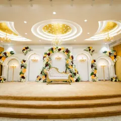 The stage is the heart of your celebration, and I ensure it's nothing short of spectacular. This is an example of a premium floral decor setup in a Vashi banquet hall, designed to be the perfect backdrop for your big day.