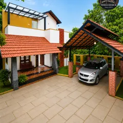 This carport blends traditional aesthetics with modern construction. We used classic Mangalore-style roofing tiles on a durable steel frame, supported by brick pillars to match the home's design. It provides reliable weather protection while preserving the property's timeless character.