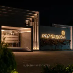 A closer perspective of the HLP Galleria facade at night. The illuminated brand signage and layered architectural elements work together to establish a strong, sophisticated presence.