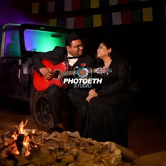 Creating a cozy campfire setting for a musical night. This pre-wedding shoot concept is perfect for couples who share a love for music and the outdoors.