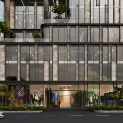 The ground level of the Bandra commercial tower, showcasing its sleek, streamlined sensibility. Expansive glass walls dissolve the boundary between exterior and interior, creating a transparent and inviting entrance.