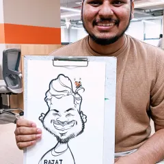 This team member was thrilled with his caricature. It's always great to see people enjoying a bit of creative fun during their workday.