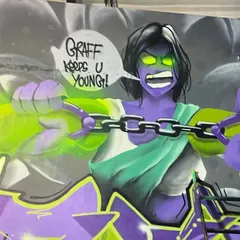A close-up of the character work. The glowing green eyes and chains show the energy I wanted to capture. This is a good example of how I develop characters for large murals.