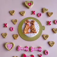 Spreading the love with our Valentine's Day collection. This flat lay shows our "Furr-ever Valentine" cake, heart-shaped cookies, and other romantic treats.