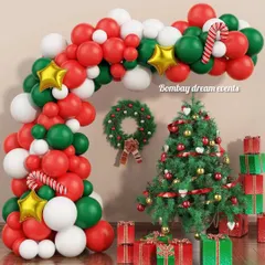 I can turn any corner of your home into a Christmas wonderland. This setup includes a classic decorated Christmas tree, a festive wreath, and a beautiful red, green, and white balloon arch to frame the scene.
