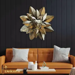 A single, large metal flower with layered petals in an antique gold finish. This bold and elegant piece serves as a powerful focal point in a minimalist living room or an executive office.