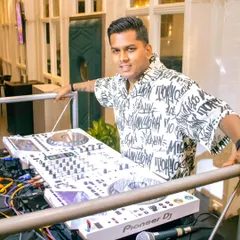 Posing with my all-white Pioneer DJ setup at Grey Cravings in Mumbai. The right equipment is essential for a professional performance.