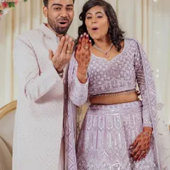 That "we're engaged!" feeling. This shot captures the couple's shared excitement as they admire the ring, a perfect candid moment filled with surprise and joy.