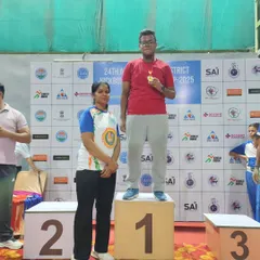 One of our dedicated athletes stands proudly on the number one podium after winning gold. This is the result of countless hours of training and dedication in our kickboxing program.