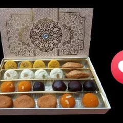Celebrate your special moments with our handcrafted sweet boxes. This assortment features a variety of traditional sweets like Rasagola, Ladoo, and more, making it the perfect gift for festivals and corporate events.